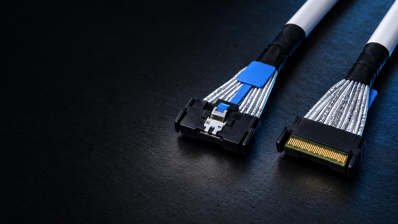 MCIO cable connectors with blue release tabs
